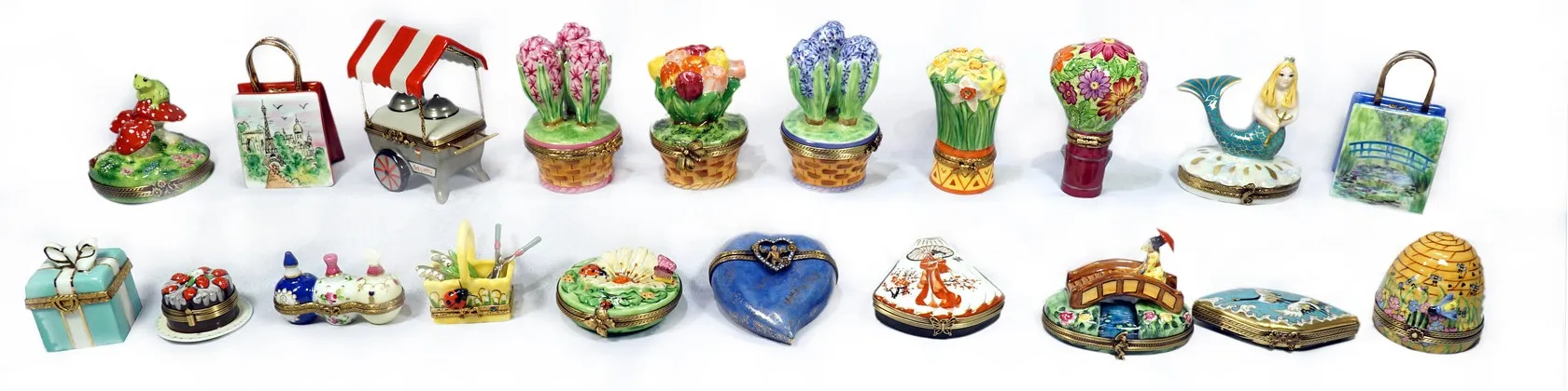 A row of hand-painted Limoges porcelain trinket boxes